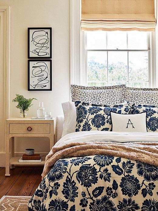 The raffia-covered nightstand and the faux-fur throw bring a literal touch of the outdoors into this bedroom. The Carrie Leopard Shams and the floral duvet cover introduce natural motifs; the Harper Monogram Boudoir Sham gives the room a Southern accent.
 
